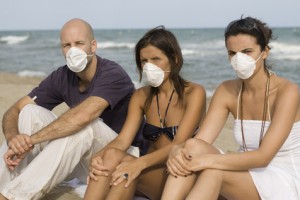 Three young adults with protection masks against birdflu