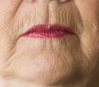 Close-up of a senior woman looking off to the left.